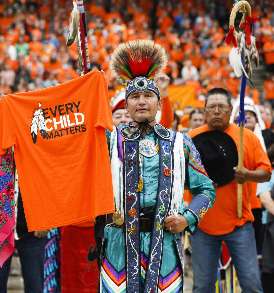 FILE - Wab Kinew attends the second annual Orange Shirt Day Survivors Walk and Pow Wow on National Day for Truth and Reconciliation in Winnipeg, Manitoba, Sept. 30, 2022. The Canadian province of Manitoba has elected the first First Nations premier of a province in Canada. Manitobans elected an NDP government led by Wab Kinew, was raised as a young boy on the Onigaming First Nation in northwestern Ontario, later moving with his family to Winnipeg. (John Woods/The Canadian Press via AP)