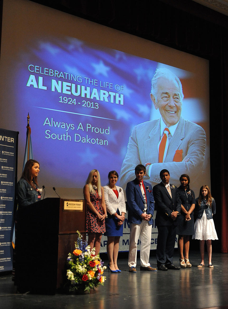 Al Neuharth's children and grandchildren: Karina Fornes-Neuharth, left to right; Alexis Fornes-Neuharth, Dani Keusch, AJ Keusch, Andre Fornes-Neuharth, Ariana Fornes-Neuharth and Rafi Fornes-Neuharth speak during a memorial service in honor of USA Today founder Al Neuharth at Aalfs Auditorium in Slagle Hall on the campus of the University of South Dakota in Vermillion, S.D., Friday, May 17, 2013. Neuharth died at his Cocoa Beach, Fla., home on April 19 at the age of 89. (AP Photo/Argus Leader, Jay Pickthorn)