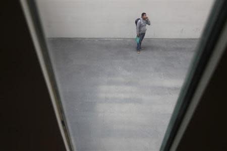 A man speaks on his mobile phone in Mexico City September 26, 2012. REUTERS/Edgard Garrido