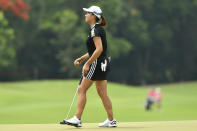 Hinako Shibuno of Japan reacts after putting on the 18th green during the final round of the LPGA Honda Thailand golf tournament in Pattaya, southern Thailand, Sunday, May 9, 2021. (AP Photo/Kittinun Rodsupan)