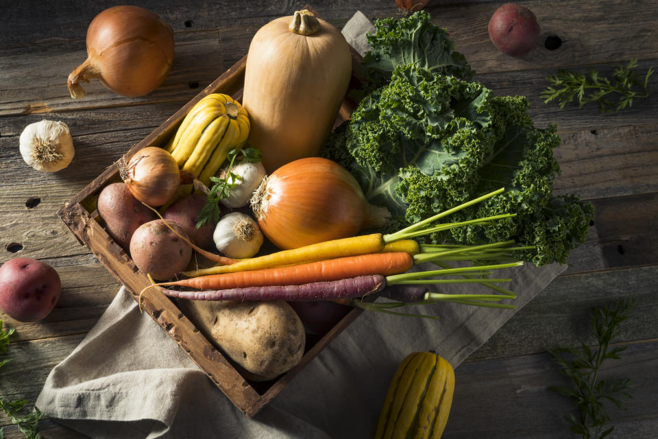 Raw Organic Winter Farmers Market Box with Potatoes Garlic Onion Squash and Kale. Colourful vegetables can be a great addition to your seasonal diet this winter. (Getty)