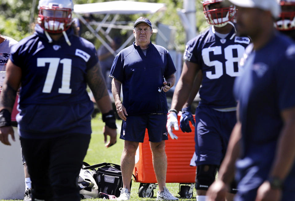 New England Patriots head coach Bill Belichick watches players during practice, making sure no one’s having fun. (AP)