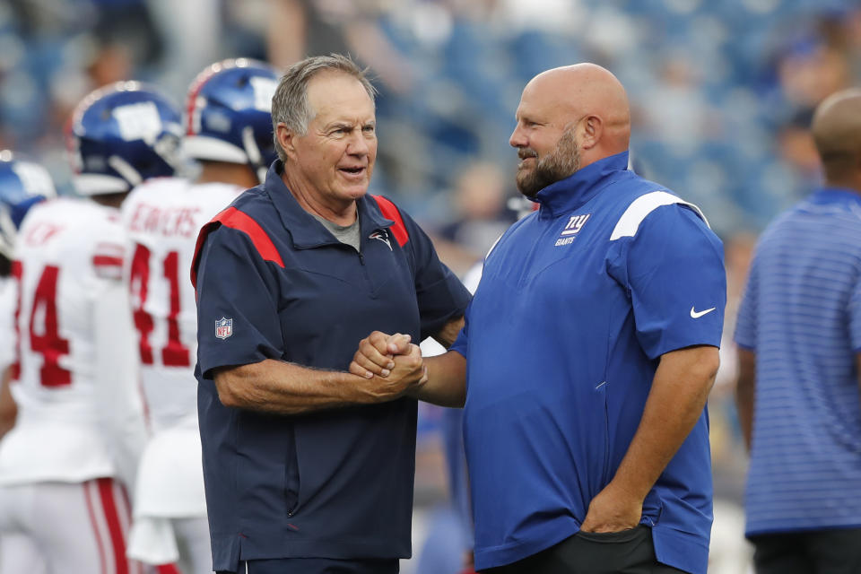 New England Patriots coach Bill Belichick, left, greets New York Giants coach Brian Daboll before an NFL preseason football game Thursday, Aug. 11, 2022, in Foxborough, Mass. (AP Photo/Michael Dwyer)