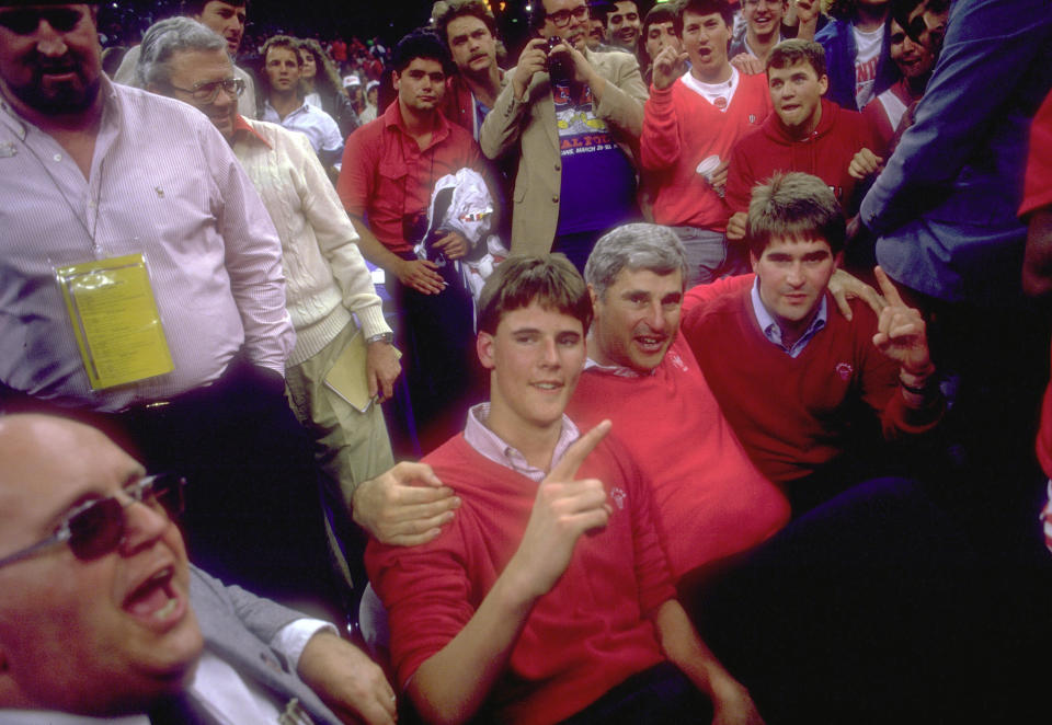 Bob Knight celebrates with his two sons Pat (left) and Tim (right) after winning the 1987 NCAA championship. (Rich Clarkson/Getty Images)