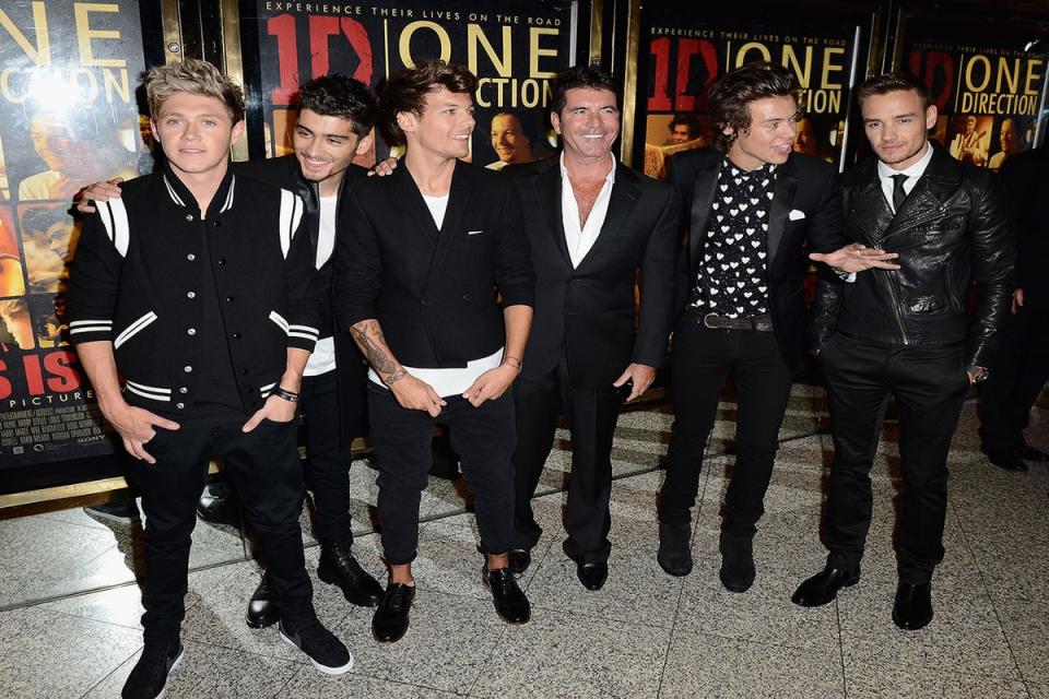 Cowell and One Direction at the launch of their film This Is Us (Ian Gavan/Getty Images)