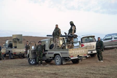 Members of the Kurdish security forces take part in an intensive security deployment after clashes with Islamic State militants in Jalawla, Diyala province November 23, 2014. REUTERS/Stringer