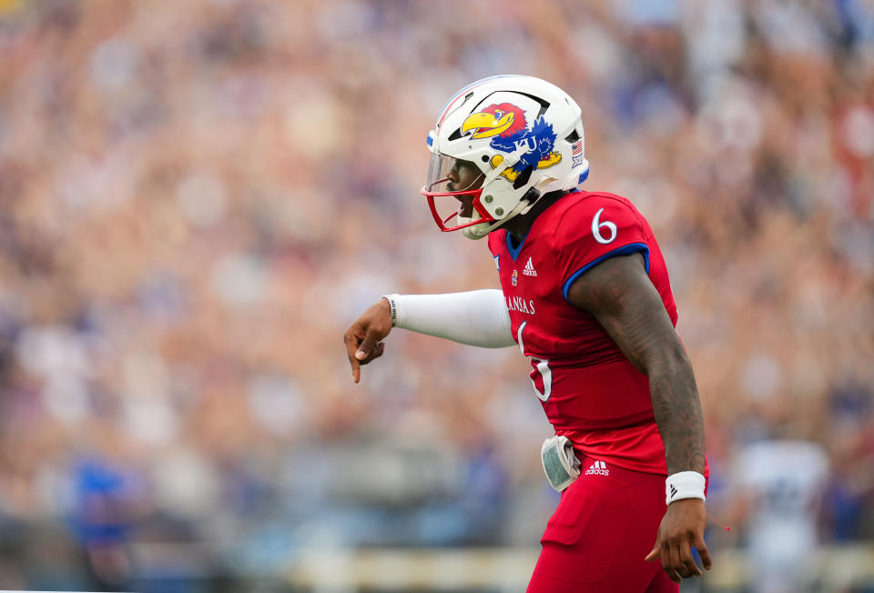 Sep 23, 2023; Lawrence, Kansas, USA; Kansas Jayhawks quarterback Jalon Daniels (6) celebrates after scoring a touchdown during the first half against the Brigham Young Cougars at David Booth Kansas Memorial Stadium. Mandatory Credit: Jay Biggerstaff-USA TODAY Sports