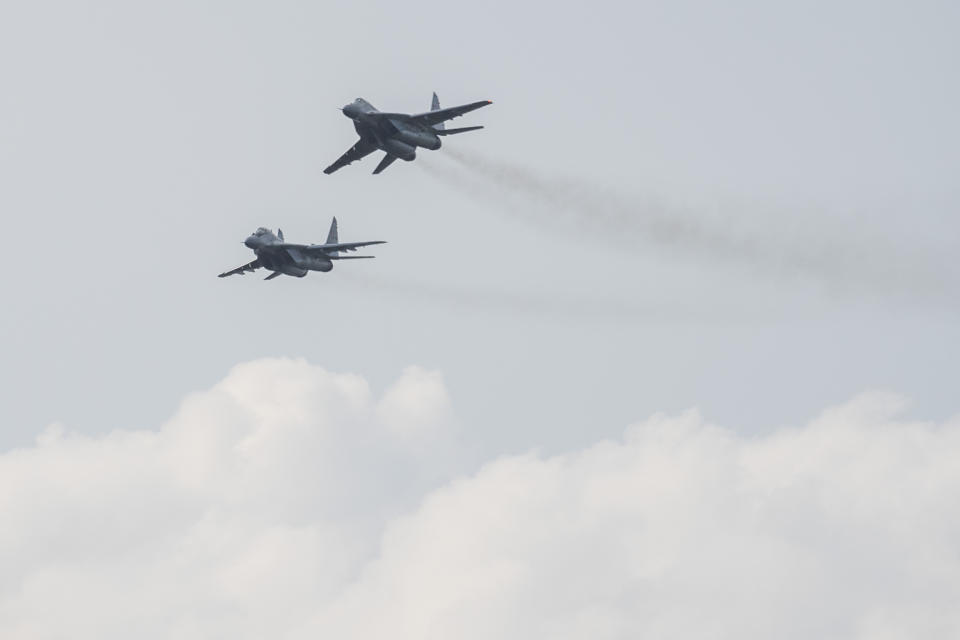 FILE - MIG-29 fighter jets in flight at the 11th SIAF International Aviation Day at the Malacky-Kuchyna Air Base, in Kuchyna, Slovakia, Saturday, Aug. 27, 2022. Slovakia’s government has approved a plan to give Ukraine its fleet of Soviet-era MiG-29 fighter jets. Prime Minister Eduard Heger announced the unanimous decision of his government on Friday, March 17, 2023. (Jaroslav Novak/TASR via AP, File)