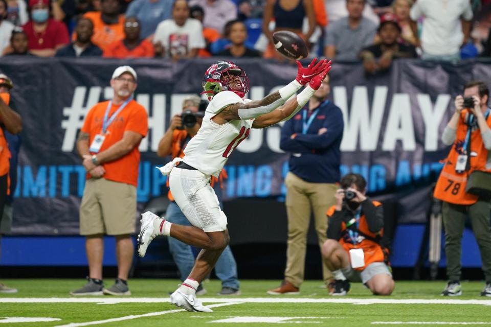 Dec 3, 2021; San Antonio, TX, USA; Western Kentucky Hilltoppers wide receiver Malachi Corley (11) reaches for a ball during the first half of the 2021 Conference USA Championship Game against the UTSA Roadrunners at the Alamodome. Mandatory Credit: Daniel Dunn-USA TODAY Sports