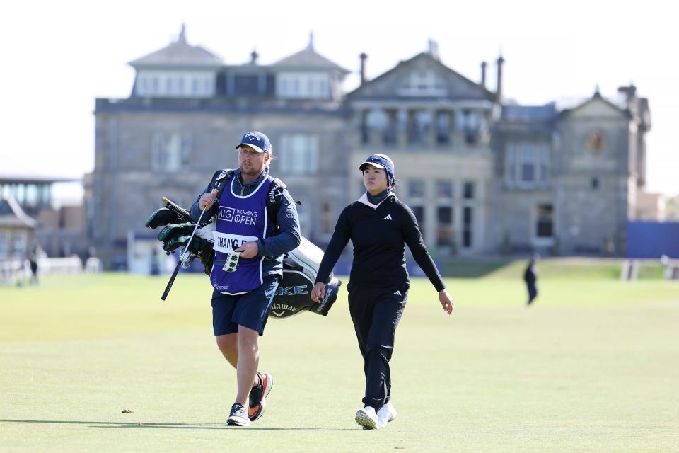 ST ANDREWS, SCOTLAND - AUGUST 22: Rose Zhang of the United States walks on the first hole alongside her caddie during Day One of the AIG Women's Open at St Andrews Old Course on August 22, 2024 in St Andrews, Scotland. (Photo by Ross Parker/R&A/R&A via Getty Images)