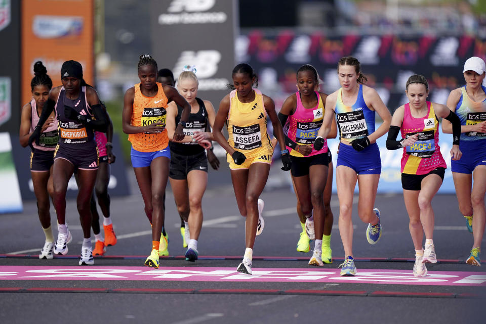 Runners including Joyce Chepkirui, Brigid Kosgei, Becky Briggs, Tigst Assefa and Mhairi Maclennan as the women's elite race gets under way at the London Marathon, London, Sunday April 21, 2024. (Zac Goodwin/PA via AP)