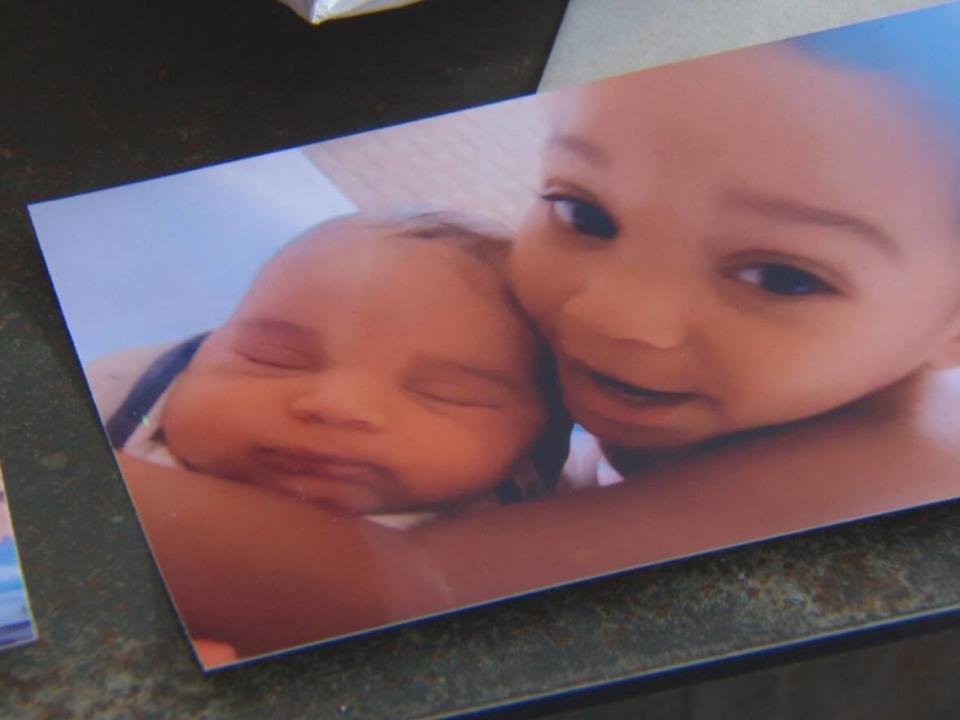 Gloria Luhaka shares a photo of her children on Tuesday. Two-year-old Brantly, on seen on the right, died at CHEO in early March. (Francis Ferland/CBC - image credit)