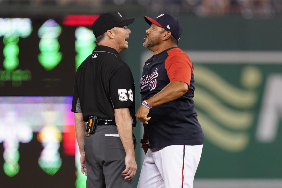 Washington Nationals manager Dave Martinez, right, argues with umpire Dan Iassogna after a play in the 10th inning of the second game of a baseball doubleheader against the Philadelphia Phillies, Friday, June 17, 2022, in Washington. Martinez was ejected after the play. (AP Photo/Patrick Semansky)