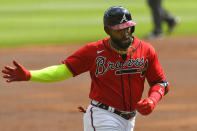 Atlanta Braves' Marcell Ozuna runs the bases on a home run during the first inning of a baseball game against the Boston Red Sox, Sunday, Sept. 27, 2020, in Atlanta. (AP Photo/John Amis)