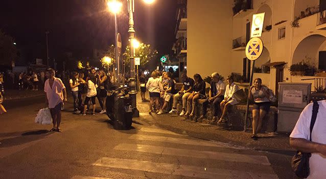 People lined the streets after the earthquake caused buildings to collapse. Source: AAP