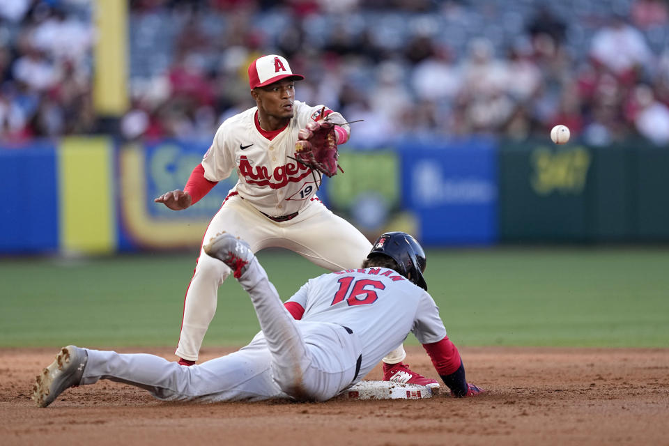 St. Louis Cardinals' Nolan Gorman, right, dives into second as he tags from first after Pedro Pages lined out as Los Angeles Angels second baseman Kyren Paris takes a late throw during the second inning of a baseball game Tuesday, May 14, 2024, in Anaheim, Calif. (AP Photo/Mark J. Terrill)