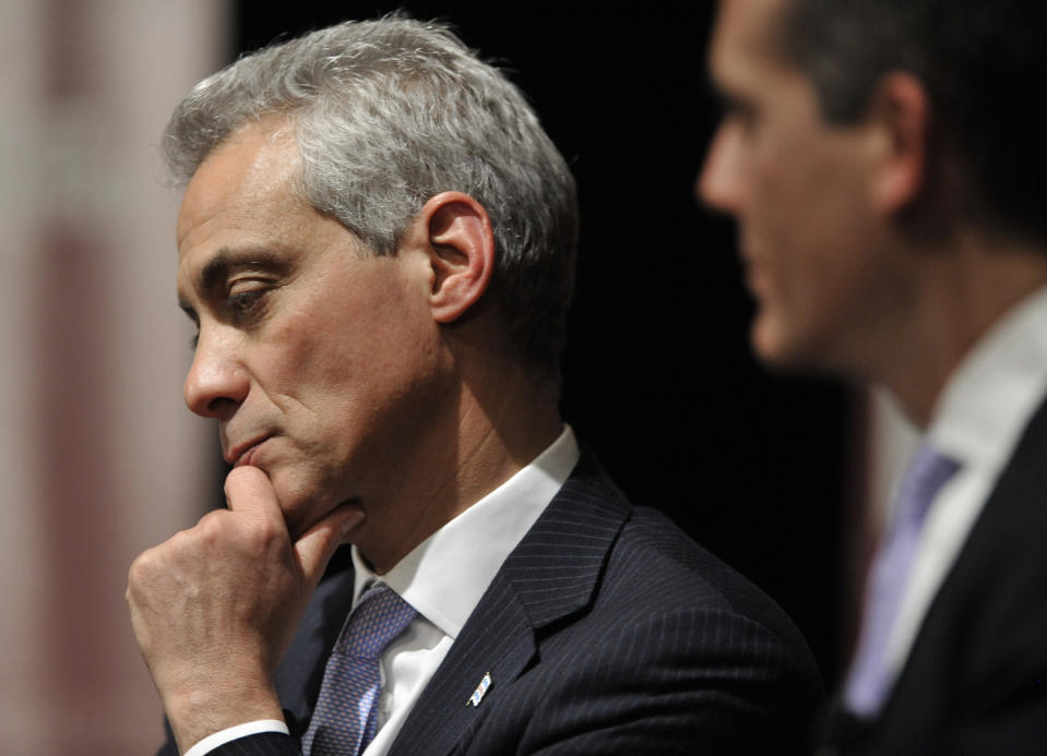 FILE - In this March, 6, 2014 file photo Chicago Mayor Rahm Emanuel left, listens while Los Angeles Mayor Eric Garcetti right, looks on during a panel discussion about the issues facing the nation's big cities at the University of Chicago, in Chicago. Emanuel, the hard-charging mayor is intent on fixing what ails the nation’s third-largest city, no matter whom he ticks off in the process. The man once nicknamed “Rahmbo” for his fierce political maneuvering, last week announced an agreement with several unions to help bail out the nation’s worst-funded city pension systems, a festering problem inherited from his predecessor, Richard M. Daley. Emanuel said the deal, which would slice Chicago’s nearly $20 billion shortfall in half by cutting benefits and raising property taxes, would keep the funds from insolvency and avoid massive cuts in services and a record tax hike. (AP Photo/Paul Beaty,File)