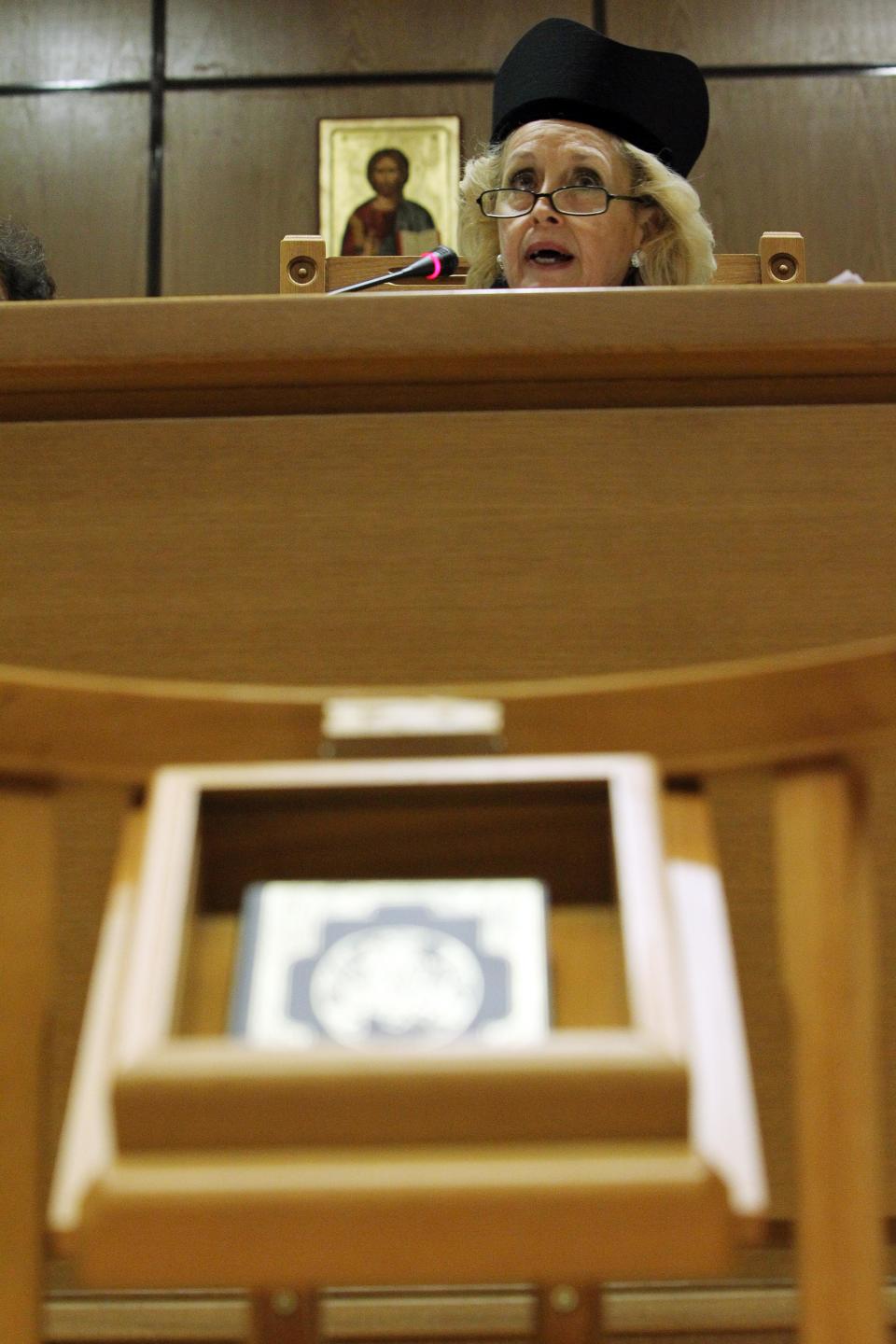 The head of Greece's Association of Judges and Public Prosecutors, Vassiliki Thanou delivers a speech during a protest of judicial officials at country's Supreme Court building in Athens, Monday, Sept. 17, 2012. In the most serious confrontation between unions and the Greek coalition government since it was formed three months ago, the country's judges and hospital doctors on Monday began what they intend to be lengthy protests against planned austerity measures. (AP Photo/Thanassis Stavrakis)