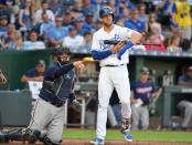 Jul 21, 2018; Kansas City, MO, USA; With Kansas City Royals third baseman Hunter Dozier (17) batting, Minnesota Twins catcher Bobby Wilson (46) looks to first base umpire for a call verification in the third inning at Kauffman Stadium. Mandatory Credit: Denny Medley-USA TODAY Sports