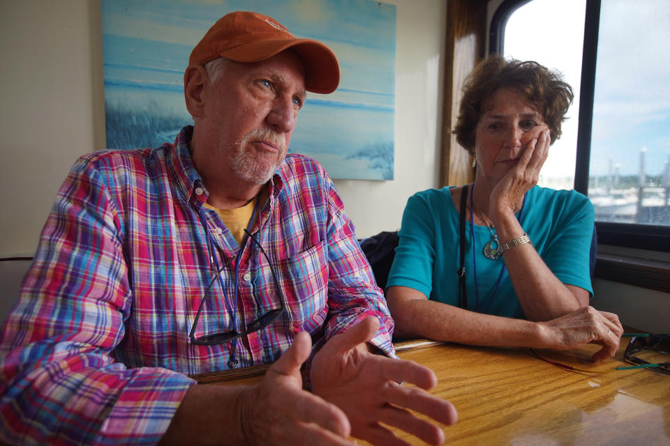 DENNIS, MA - AUGUST 27: Seth Stoffregen of Wellesley and friend Deborah Schilling, a realtor from Cotuit, take part in a cruise sponsored by AMR Asset Management Financial Resources in Dennis, MA on Aug. 27, 2019. Menacing rumbles from Wall Street echoed across the placid waters of Cape Cod Bay last week as a boatload of graying day trippers returned to Sesuit Harbor. It was meant to be a carefree outing: A Hyannis financial planning firm had chartered the S.S. Lobster Roll, a twin-diesel party boat, to fete about 50 clients. But even amid the seaborne laughter, passengers were rattled by the recent market turbulence. Like millions in or approaching retirement, they wondered how the mounting uncertainty might affect their financial future. (Photo by Barry Chin/The Boston Globe via Getty Images)