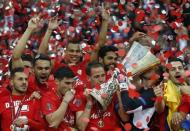 Football - Dnipro Dnipropetrovsk v Sevilla - UEFA Europa League Final - National Stadium, Warsaw, Poland - 27/5/15 Sevilla's Fernando Navarro lifts the trophy as they celebrate winning the UEFA Europa League Final Reuters / Carl Recine