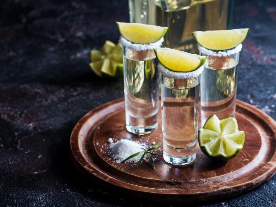 tequila shots with lime wedges