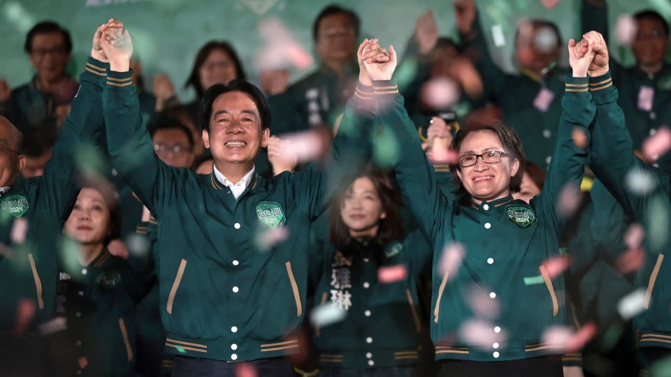 Taiwan's President-Elect, Lai Ching-te (left), celebrates with his running mate, Hsiao Bi-khim, during a rally outside the headquarters of the Democratic Progressive Party (DPP) in Taipei on January 13, after winning the presidential election. - Yasuyoshi Chiba/AFP/Getty Images