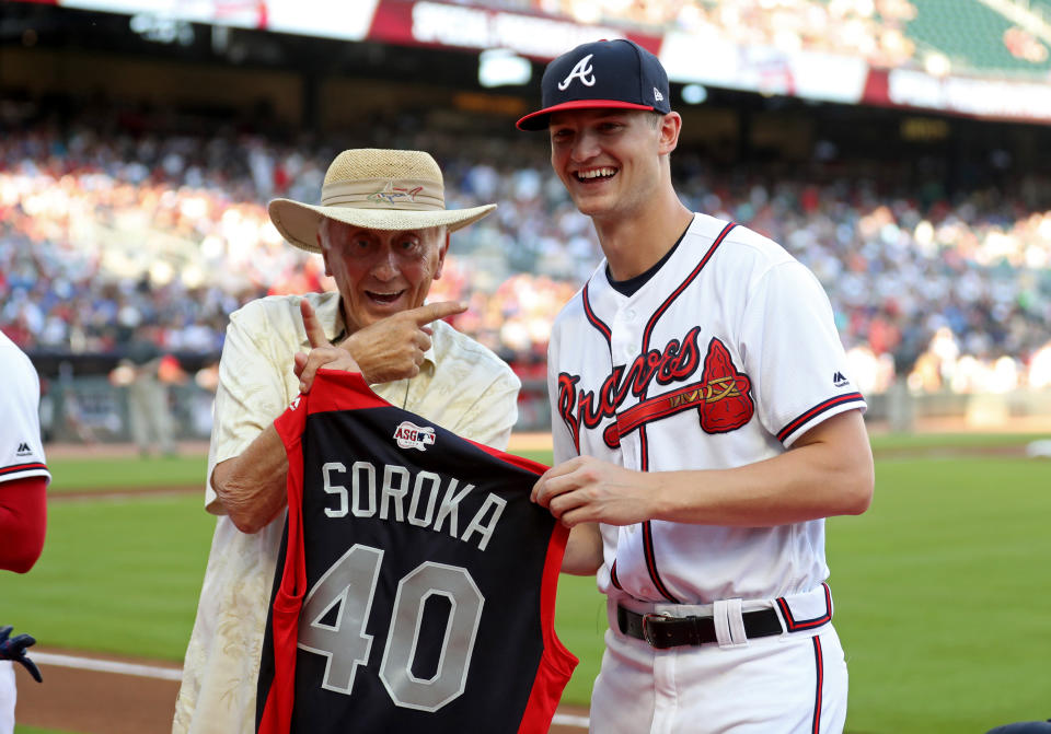 Jul 2, 2019; Atlanta, GA, USA; Atlanta Braves starting pitcher Mike Soroka (40) is honored with his All-Star jersey by Braves former pitcher Phil Niekro (left) before a game against the Philadelphia Phillies at SunTrust Park. Mandatory Credit: Jason Getz-USA TODAY Sports