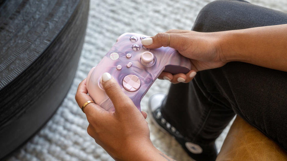 Xbox Dream Vapor controller with pink and purple swirls and buttons.