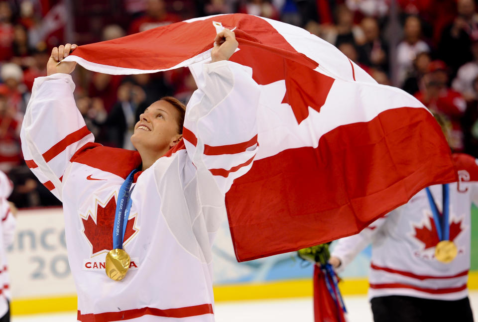 VANCOUVER, BC - FEBRUARY 25:  Goalie Canada's Kim St-Pierre carries the Canadian flag.
Canada beat USA 2-0 for the gold medal.
The Women's hockey gold medal game was held today between Canada and the USA at the Canada Hockey Place.        (Richard Lautens/Toronto Star via Getty Images)