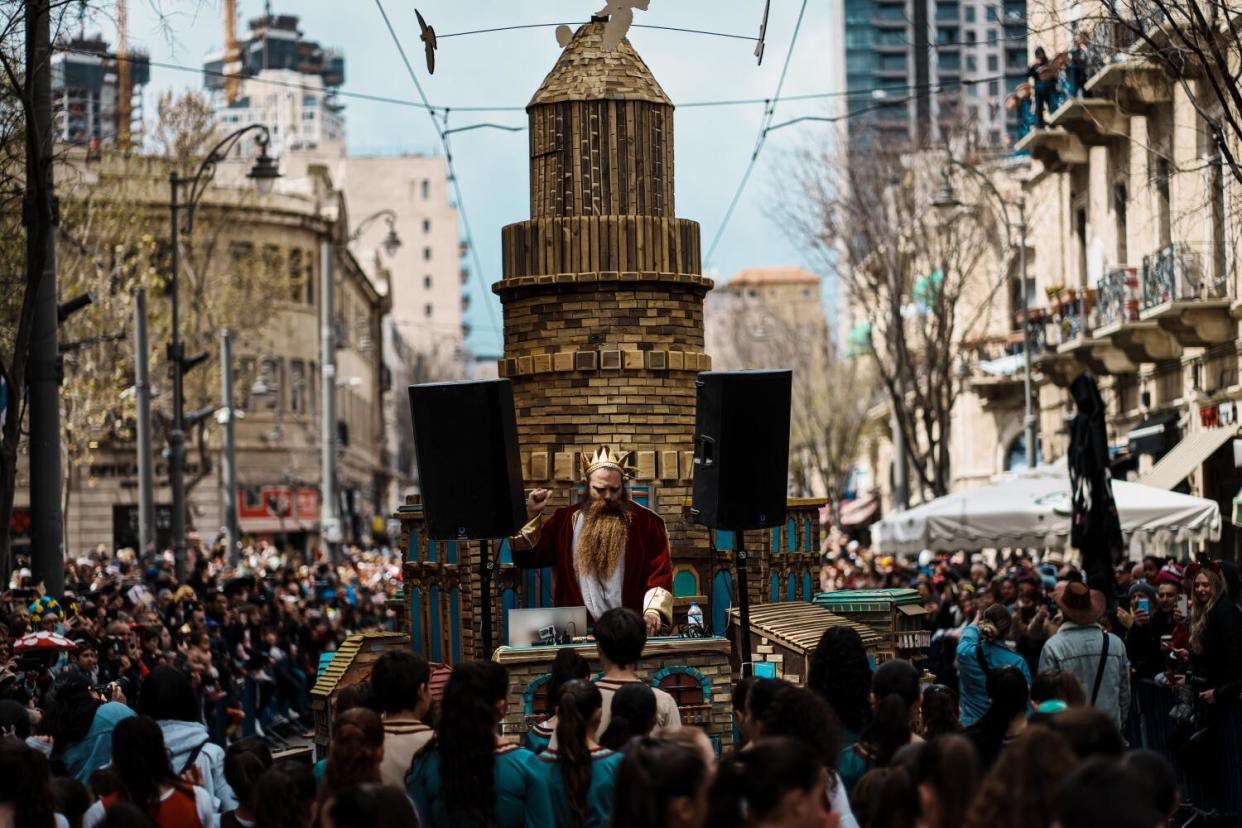 At Purim festivities in Jerusalem, dancers from a municipal group attend the parade.