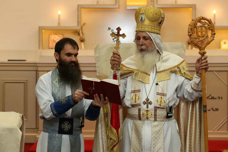 Senior Parish Priest Isaac Royel (L) and Bishop Mar Mari Emmanuel during the 2023 Holy Resurrection Feast services, in Sydney, Australia (via REUTERS)