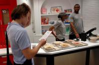 A guest looks at a cereal menu at the Kellogg's NYC cafe in Midtown Manhattan in New York City, U.S., June 29, 2016. REUTERS/Brendan McDermid