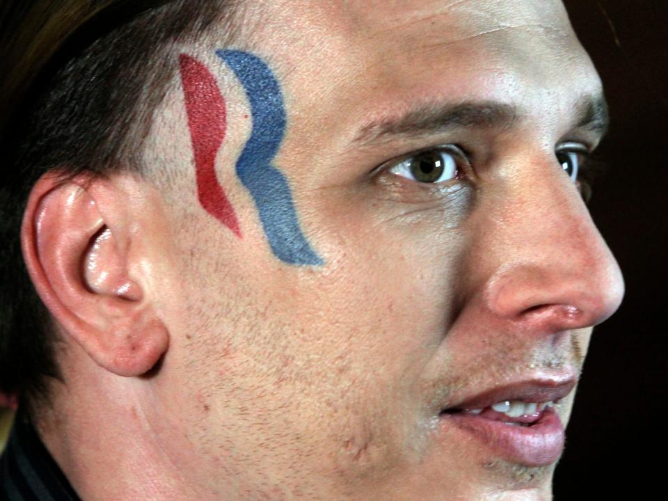 Eric Hartsburg, an Indiana-based wrestler and one-time fan of GOP presidential candidate Mitt Romney, who tattooed the Romney campaign logo on his face