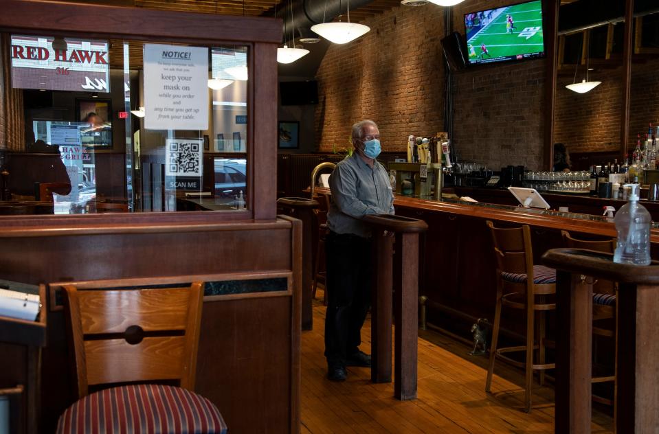 Roger Hewitt, owner of Red Hawk Bar and Grill poses for a photo inside of the restaurant in Ann Arbor, Friday, Oct. 30, 2020.