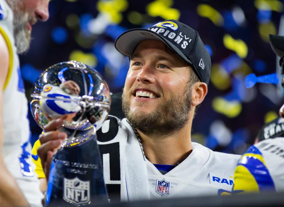 Los Angeles Rams quarterback Matthew Stafford celebrates with the Lombardi Trophy after defeating the Cincinnati Bengals in Super Bowl LVI at SoFi Stadium.