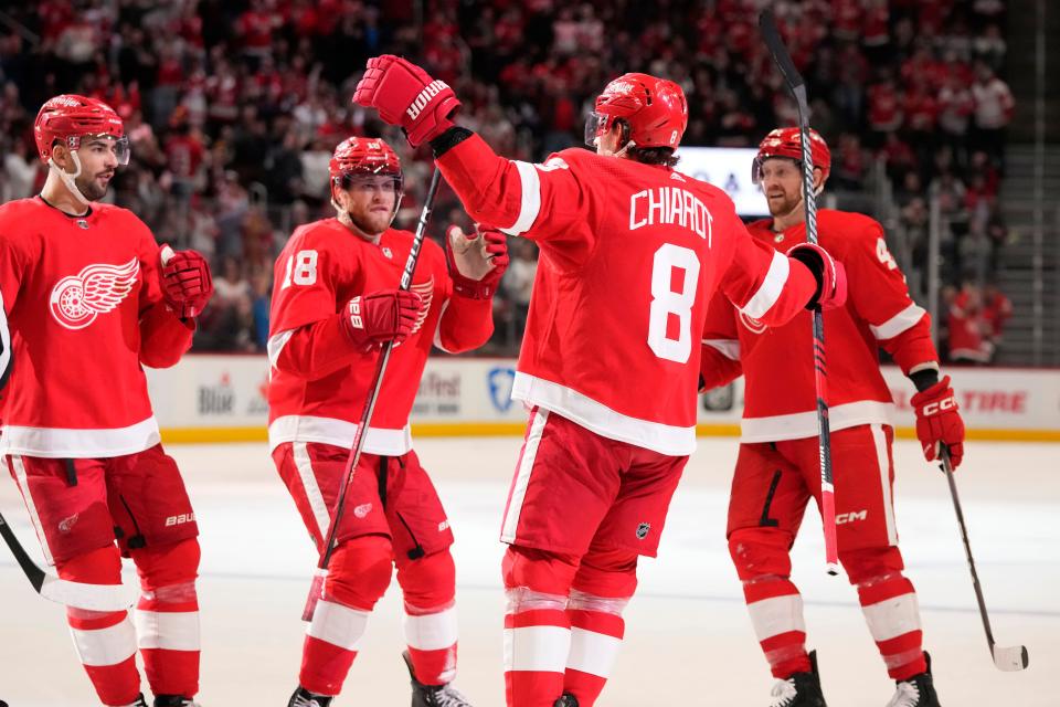 Detroit Red Wings defenseman Ben Chiarot (8) is greeted by teammates after scoring during the second period against the Boston Bruins at Little Caesars Arena in Detroit on Sunday, Dec. 31, 2023.