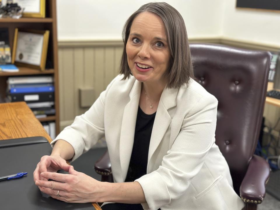 Maine Democratic Secretary of State Shenna Bellows speaks with an aide in her office after the House voted down an attempt to impeach her on Tuesday, Jan. 9, 2024, in Augusta, Maine. (AP Photo/David Sharp)