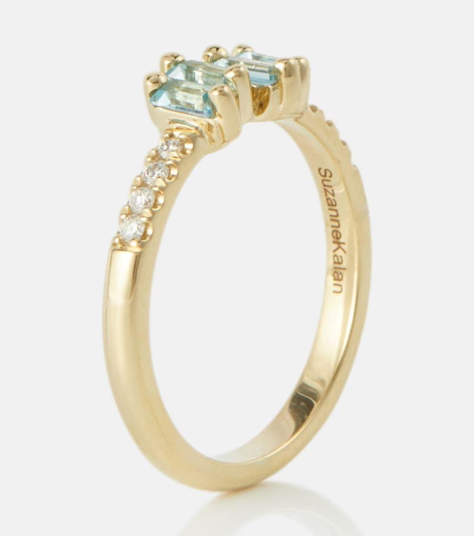 20) 14kt gold ring with diamonds and topaz