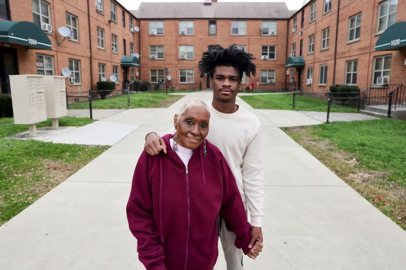 Woody and her grandson Scott stand for a portrait near the home they share in Washington