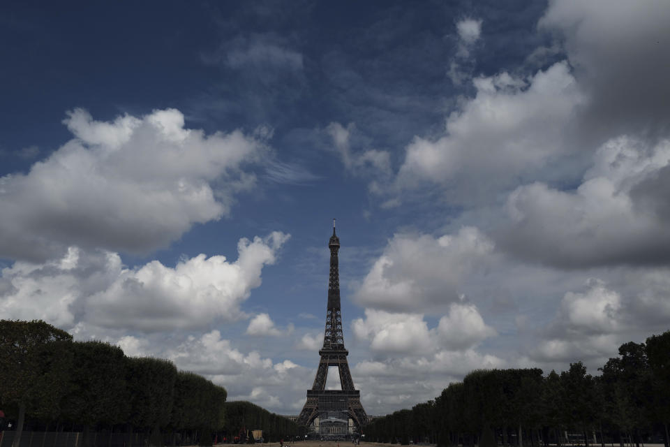 The Eiffel Tower is pictured from the Champ de Mars side during the opening up of the top floor of the Eiffel Tower, Wednesday, July 15, 2020 in Paris. The top floor of Paris' Eiffel Tower reopened today as the 19th century iron monument re-opened its first two floors on June 26 following its longest closure since World War II. (AP Photo/Francois Mori)
