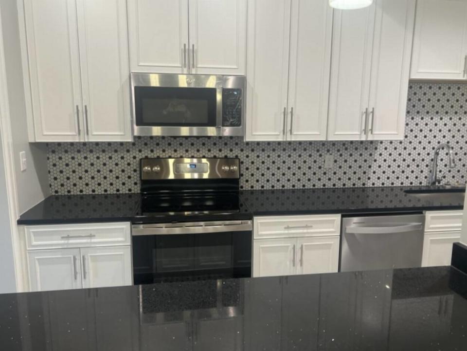 Quartz countertops and stainless steel appliances provide a modern look and style at District Flats in Pascagoula.