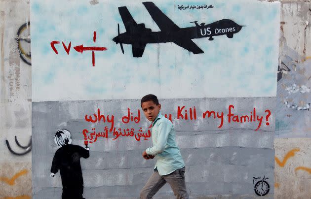 A mural depicting a U.S. drone says, 