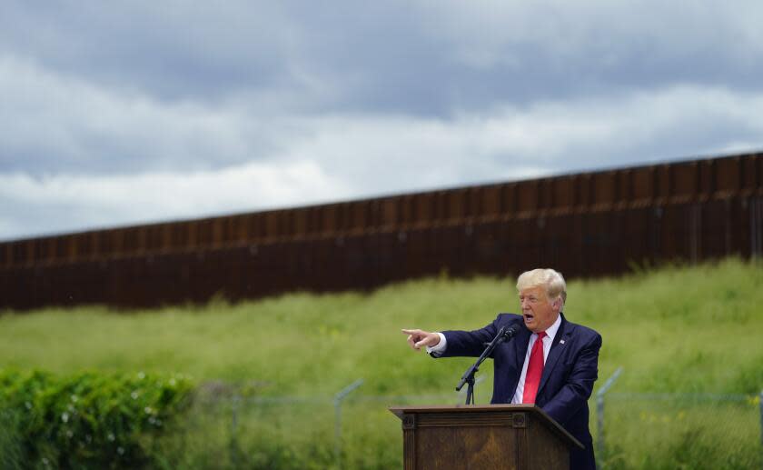 Former President Donald Trump speaks during a visit to an unfinished section of border wall with Texas Gov. Greg Abbott, in Pharr, Texas, Wednesday, June 30, 2021. (AP Photo/Eric Gay)