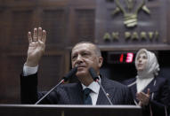 Turkey's President Recep Tayyip Erdogan addresses his ruling party MPs, in Ankara, Turkey, Tuesday, June 25, 2019, two days after Ekrem Imamoglu, the candidate of the secular opposition Republican People's Party, won the election for mayor of Istanbul. Erdogan addressed his AK Party's weekly meeting, the first time he speaks since the Istanbul mayoral election Sunday, which was a big setback for him and his party. (AP Photo/Burhan Ozbilici)