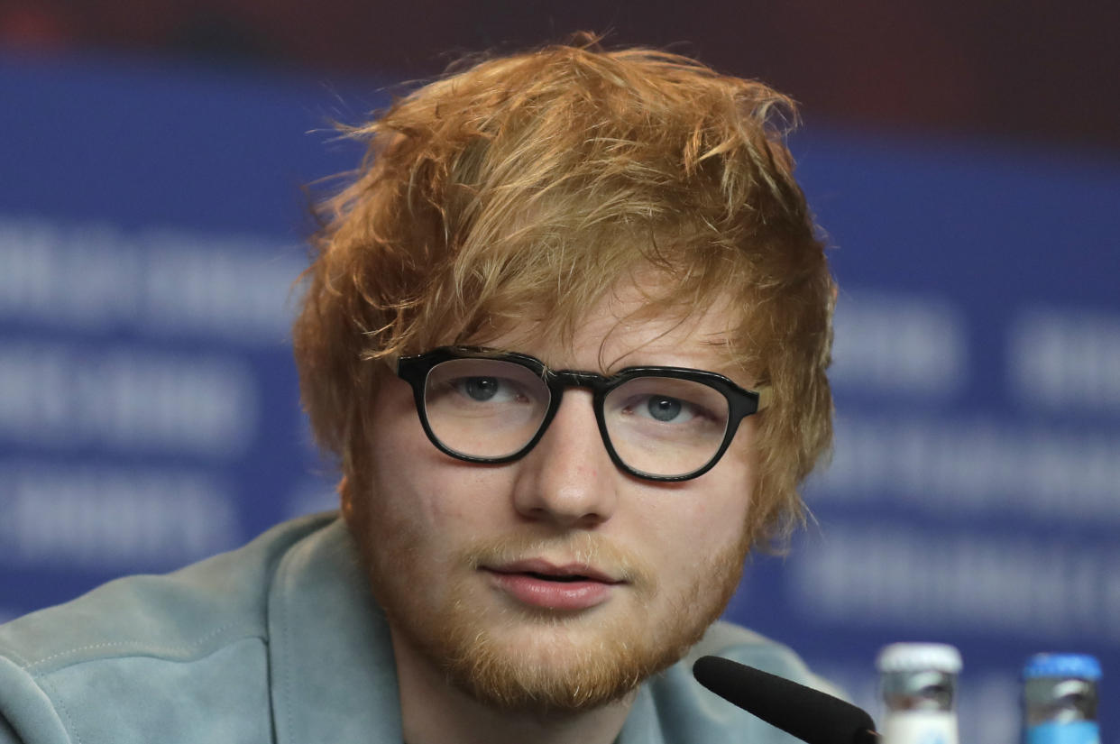 FILE - In this Friday, Feb. 23, 2018 file photo, singer-songwriter Ed Sheeran speaks during a press conference for the film 'Songwriter' during the 68th edition of the International Film Festival Berlin, Berlinale, in Berlin. Ed Sheeran has confirmed for the first time that he and long-time girlfriend Cherry Seaborn are married. British media have reported that the pair wed before Christmas in front of about 40 friends and family. In an interview, Sheeran talked about how he wrote the song “Remember the Name,” which refers to “my wife,” before getting married. (AP Photo/Markus Schreiber, FILE)