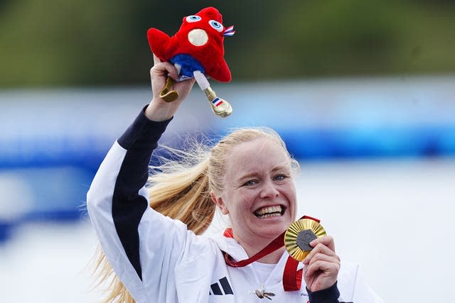 Great Britain’s Laura Sugar celebrates with the gold medal on the podium after winning the Women’s Kayak Single 200m KL3 final at the Paris Paralympics