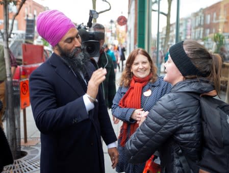 NDP leader Jagmeet Singh is greeted by supporters during an election campaign visit in Montreal