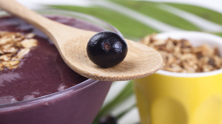 Açaí berry on a wooden spoon