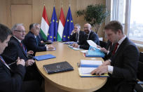 Hungarian Prime Minister Viktor Orban, third left, meets with European Council President Charles Michel, third right, on the sidelines of an EU summit in Brussels, Thursday, Feb. 20, 2020. After almost two years of sparring, the EU will be discussing the bloc's budget to work out Europe's spending plans for the next seven years. (Virginia Mayo, Pool)